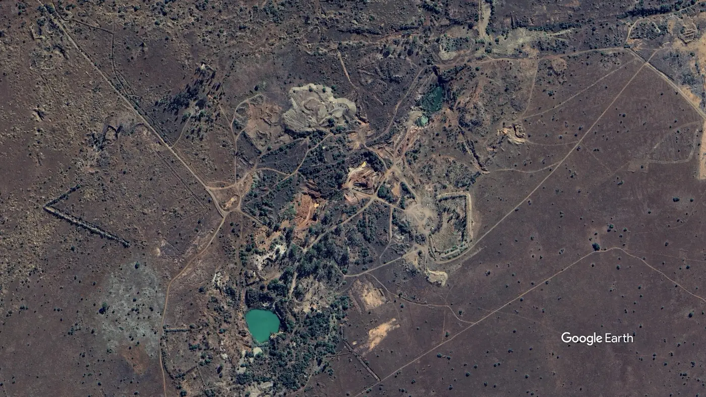 Aerial view of the 99-hectare Diamond Lakes property showing worked ground, haul roads and flooded potholes